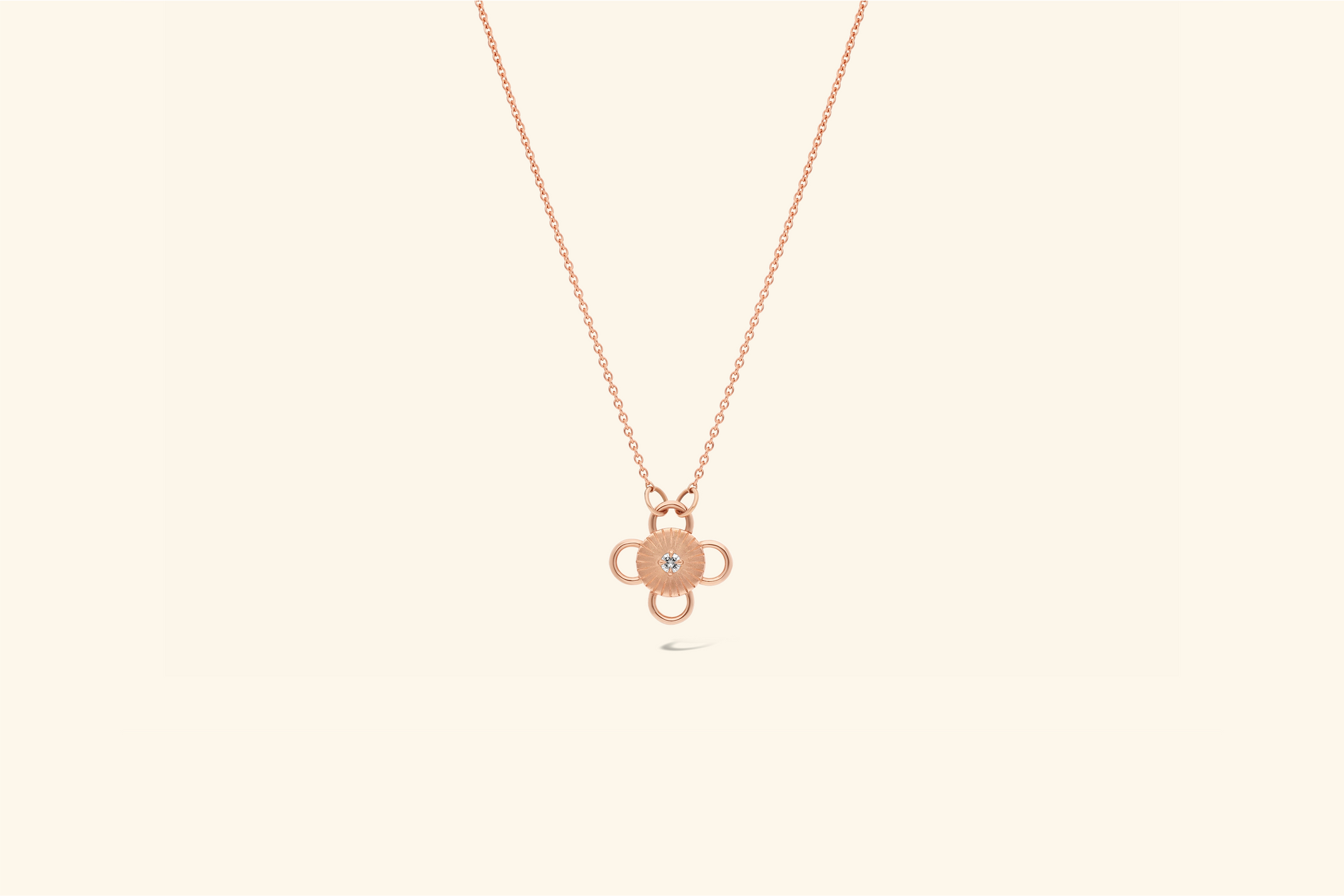 Baby Bolt Necklacea ~0.07 carat diamond set in a recycled rose gold motif.