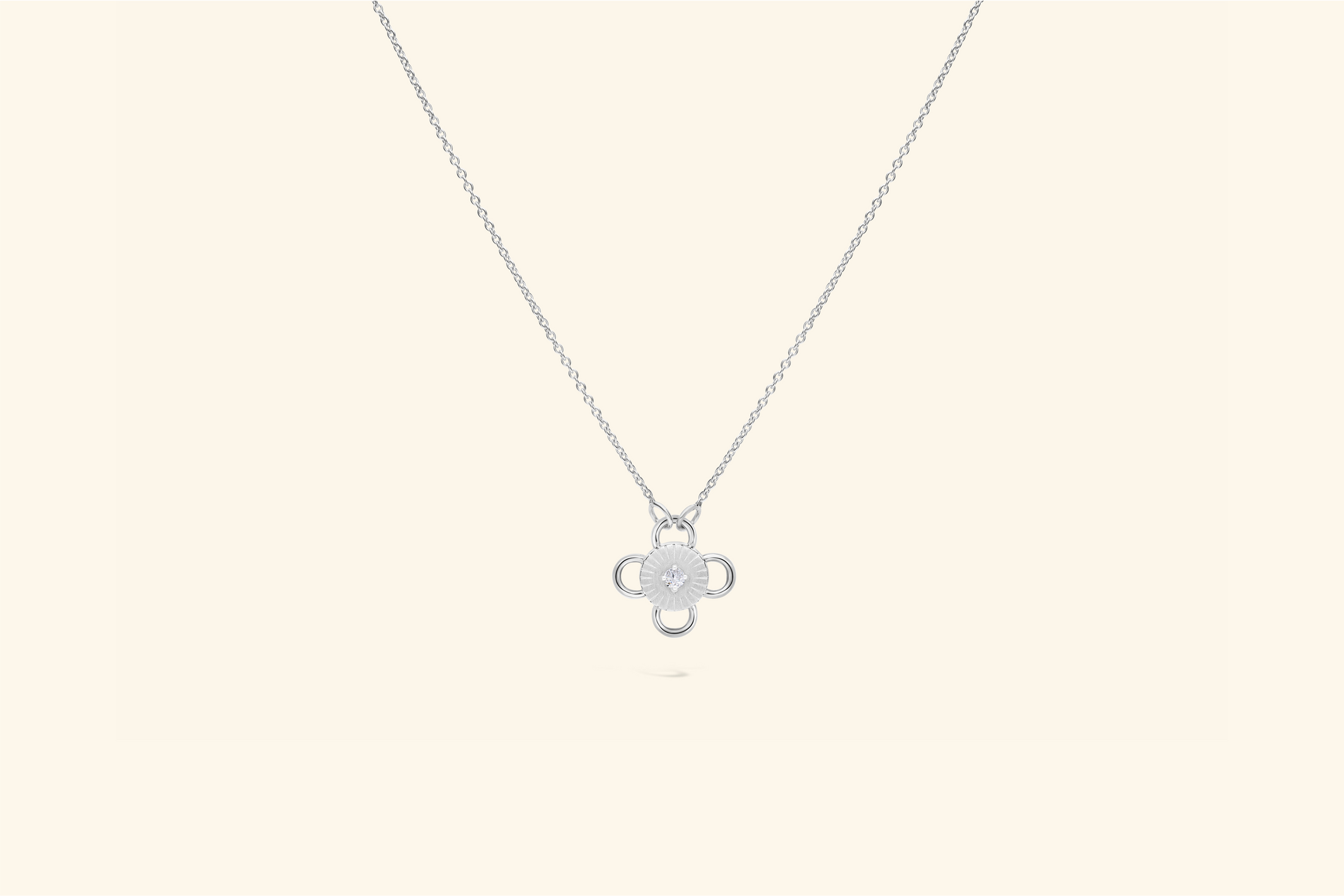 Baby Bolt Necklacea ~0.07 carat diamond set in recycled white gold.
