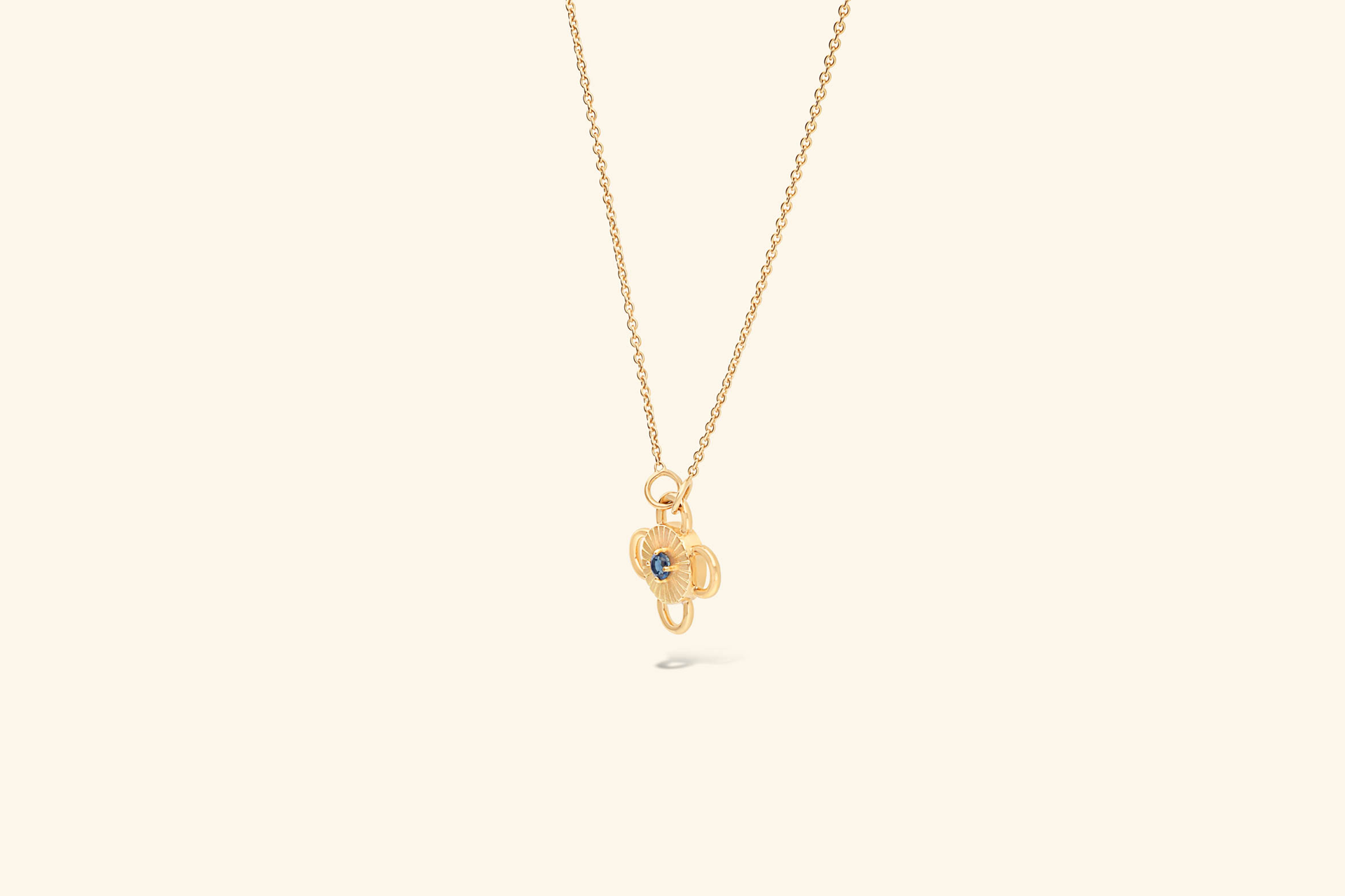 Baby Bolt Necklacea ~0.04 carat sapphire set in recycled 18k yellow gold.
